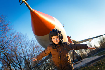 Portrait of happy young boy playing in parkの写真素材