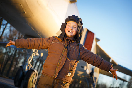 Portrait of happy young boy playing in parkの写真素材
