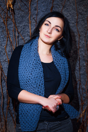 Portrait of a beautiful girl with blue scarf.の写真素材