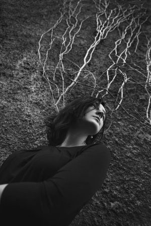 Portrait of a beautiful girl over the wallの写真素材