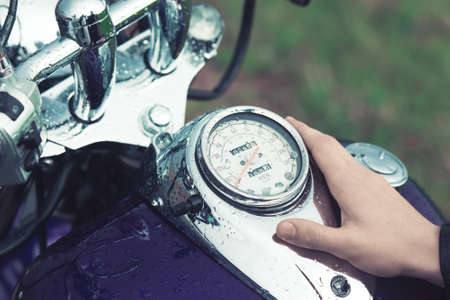 the motorcycle driver Stoke gas tank and speedometer of his bikeの写真素材