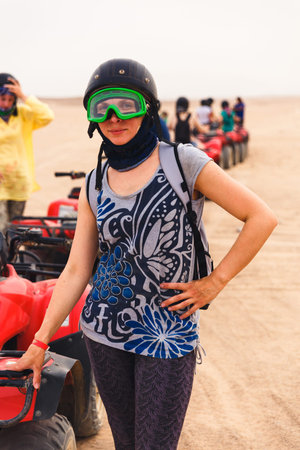 Portrait of a beautiful young lady with her motorcycle