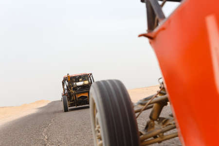 The buggies on walk through the desert in Egypt. Close up shot out of a moving car.の写真素材