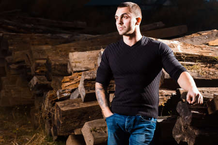 casual young man with tattoo standing indoorsの写真素材