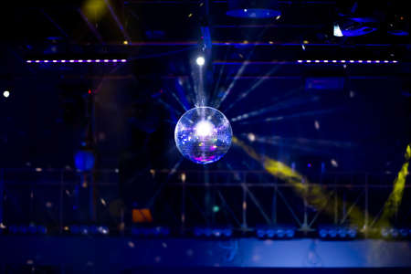 Blue disco background with mirror ball and lightsの写真素材