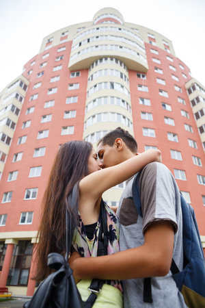Young couple in love, hugging on the street. Selective focus.の写真素材