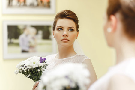 Portrait of lovely bride near by windowの写真素材