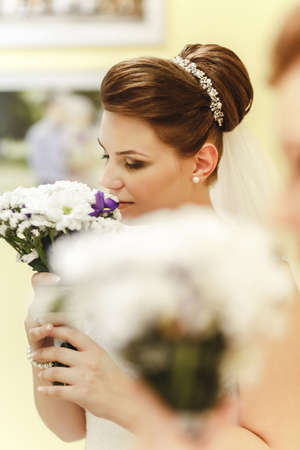 Portrait of lovely bride near by windowの写真素材