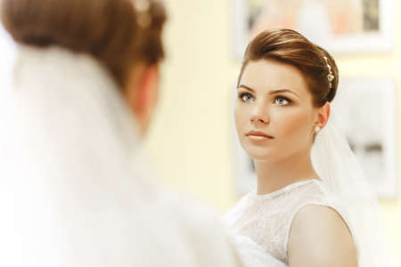 Portrait of lovely bride near by windowの写真素材