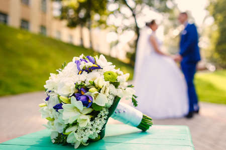 bride and groom is dancing together on city park roadの写真素材