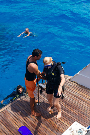 HURGHADA, EGYPT - MAY 19, 2015: Scuba diving instructor checking equipment before dive.