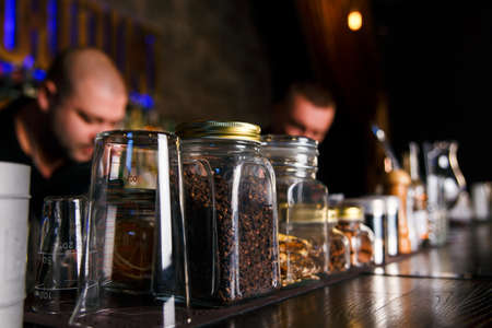 GRODNO, BELARUS - NOV 7, 2015: Two bartenders quickly working at a gastrobar HOUDINI in Grodno, Belarus, November 7, 2015のeditorial素材