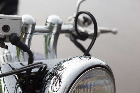 The close up of motorcycle wheel with headlightの写真素材