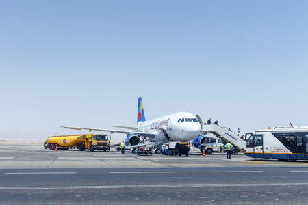 HURGHADA, EGYPT - MAY 22, 2015: Disembarking passengers from the Small Planet Airbus A320 from Warsaw in Hurghada, Egypt on May 22のeditorial素材