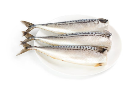 Salted mackerel on a plate isolated on the white backgroundの写真素材