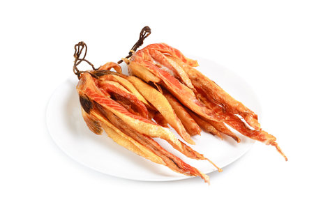 smoked salmon bellies on plate isolated on white.の写真素材