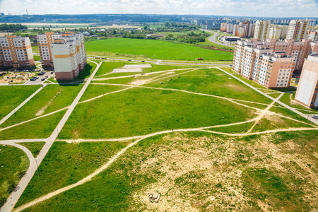 A view of the vacant lot between the apartment buildings in one district of the city of Grodno, Belarusの写真素材