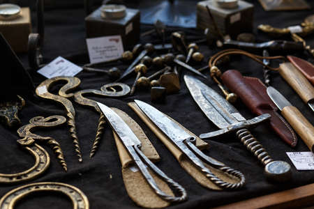 HRODNA, BELARUS - MAY 21, 2016: forged knifes and ornamental metal products in the souvenir shop in Grodno, Belarusのeditorial素材
