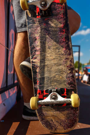 Competitions for skateboarding and scratched skateboard. Conceptual image.の写真素材