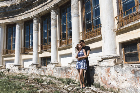 Nice couple in love on the background of ancient houseの写真素材