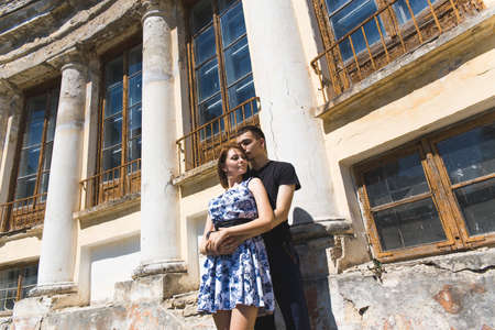 Nice couple in love on the background of ancient houseの写真素材