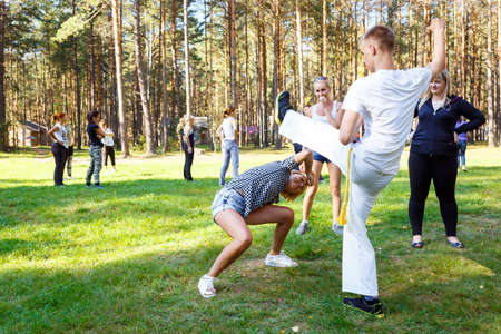 GRODNO, BELARUS - SEP 09: Group of capoeira students with master teacher in FICAG school in Grodno, Belarus at September 09, 2016のeditorial素材