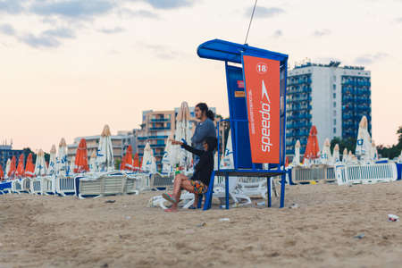 NESSEBAR, BULGARIA - SEP 02: Asian couple meets dawn on the desert city beach in Nessebar, Bulgaria at September 02, 2016のeditorial素材