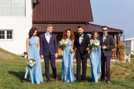 Groomsmen and bridesmaids walking on wedding ceremonyの写真素材
