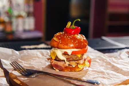 Fresh burger on paper on the barの写真素材