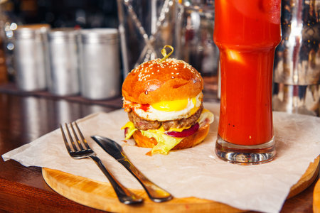 Fresh burger on paper. Close up photo.の写真素材