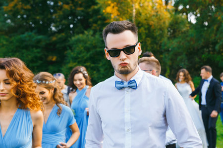Groomsmen and bridesmaids walking on wedding ceremony