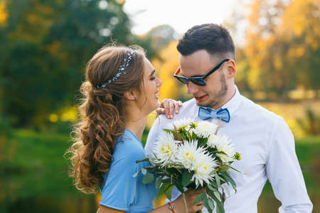 Beautiful young couple posing on wedding ceremonyの写真素材