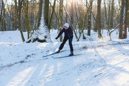 GRODNO, BELARUS - JAN 06: Amateur skier moves down the hill in a snowy forest at January 06, 2017 in Grodno, Belarusのeditorial素材