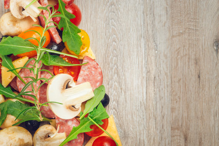 Creative composition of ingredients in the form of a slice of pizzaの写真素材