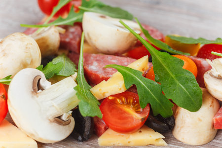 Creative composition of ingredients in the form of a slice of pizzaの写真素材