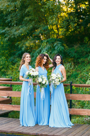 Bridesmaids in park on the wedding dayの写真素材