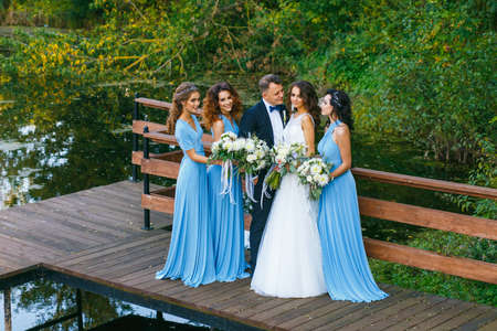 Groomsmen and bridesmaids with newly married on wedding ceremonyの写真素材