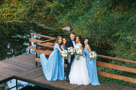Groomsmen and bridesmaids with newly married on wedding ceremonyの写真素材