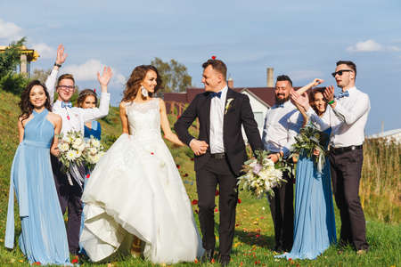 Groomsmen and bridesmaids with newly married on wedding ceremonyの写真素材