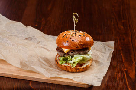 Fresh original served small burger on tableの写真素材