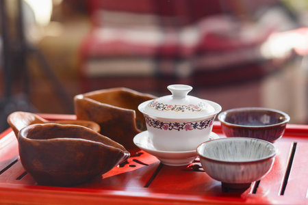 Set of teapot, three kinds of tea and two bowls on the tea desk are ready for tea ceremonyの写真素材