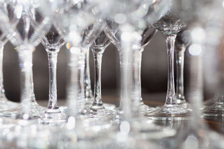 Lots of wine glasses dry on dryerの写真素材