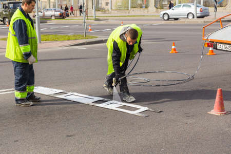Workers applied road markings on urban streetのeditorial素材