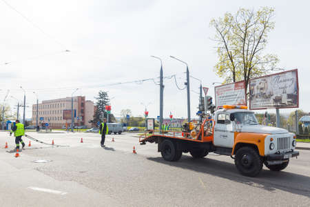 Workers applied road markings on urban streetのeditorial素材