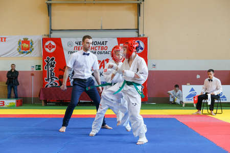 GRODNO, BELARUS - APRIL 22, 2017: Battle of the two fighters on Championship among juniors of the Grodno region Kyokushin karateのeditorial素材