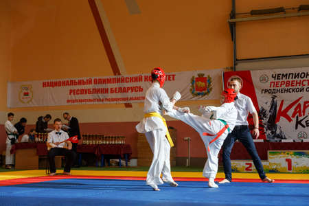 GRODNO, BELARUS - APRIL 22, 2017: Battle of the two fighters on Championship among juniors of the Grodno region Kyokushin karateのeditorial素材