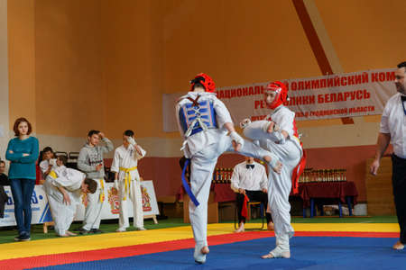 GRODNO, BELARUS - APRIL 22, 2017: Battle of the two fighters on Championship among juniors of the Grodno region Kyokushin karateのeditorial素材
