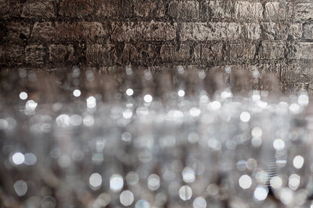 Lots of wine glasses on a brick wall background