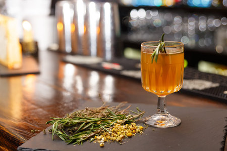 Mulled wine with white honey on black background. Traditional fall hot drink.の写真素材