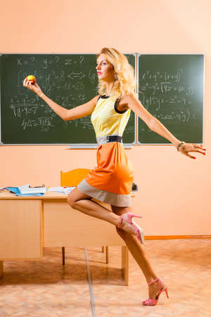 Beautiful young sexy teacher running on a lunch breakの写真素材
